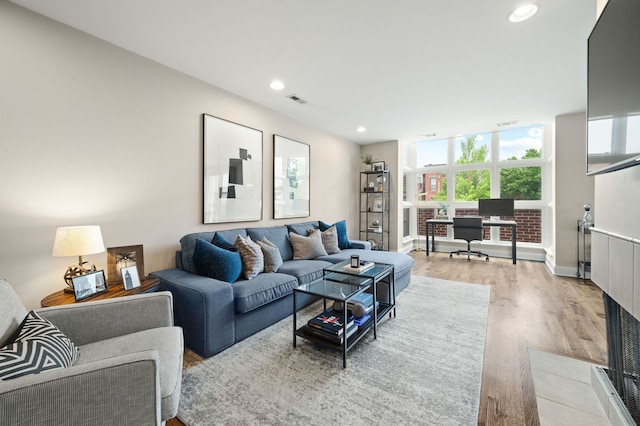2757 N Wayne Ave Unit E, Chicago, IL 60614 - living room with light wood-style floors, recessed lighting, a desk, and baseboards