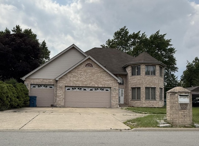 8020 Latrobe Ave, Burbank, IL 60459 - view of front of house featuring brick siding, an attached garage, and driveway