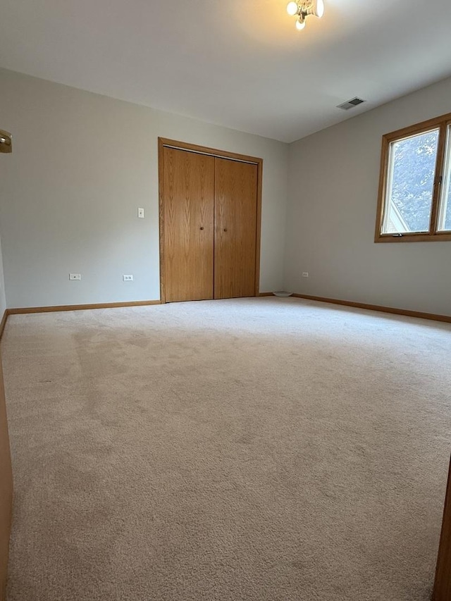 8020 Latrobe Ave, Burbank, IL 60459 - unfurnished bedroom with a closet and carpet flooring