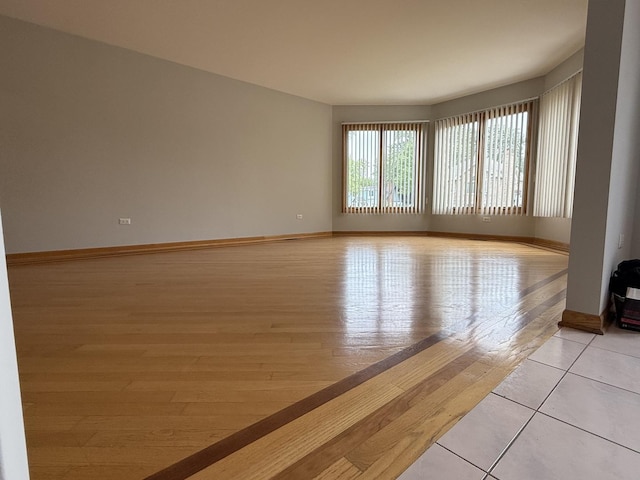 8020 Latrobe Ave, Burbank, IL 60459 - empty room with baseboards and light wood-style flooring