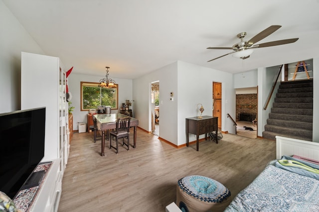 6617 Foxtree Ave, Woodridge, IL 60517 - living area featuring ceiling fan, a chandelier, light wood-style flooring, and stairs