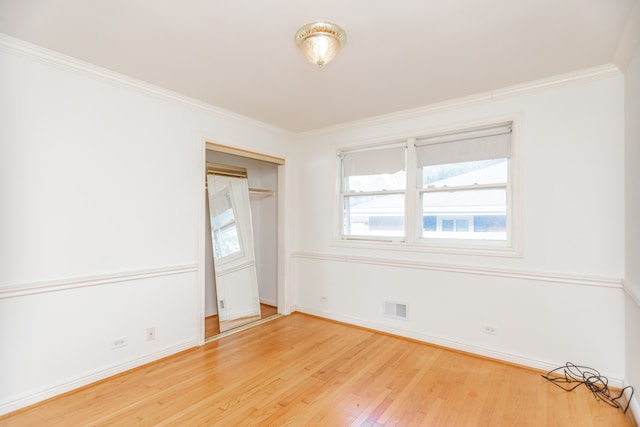 2519 Sunnyside Ave, Westchester, IL 60154 - unfurnished bedroom featuring wood finished floors, ornamental molding, and a closet