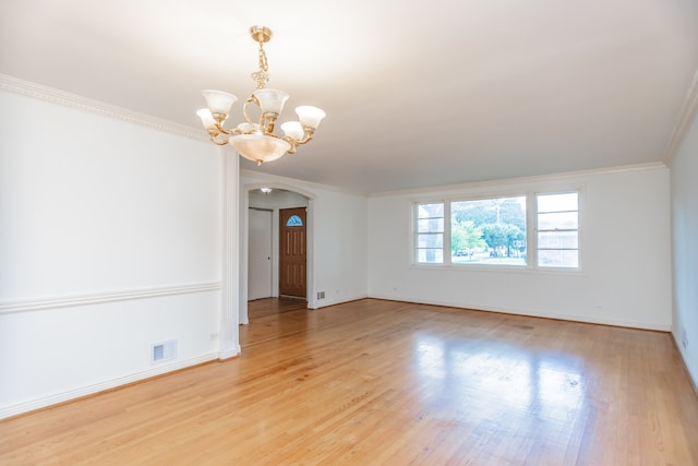 2519 Sunnyside Ave, Westchester, IL 60154 - unfurnished room featuring arched walkways, a chandelier, light wood finished floors, and crown molding