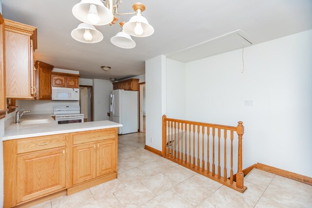 2519 Sunnyside Ave, Westchester, IL 60154 - kitchen featuring white appliances, light countertops, a peninsula, and a chandelier