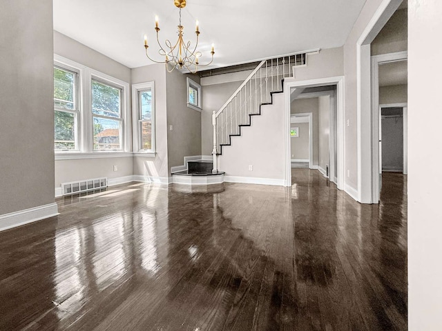 2914 Ridge Rd, Lansing, IL 60438 - unfurnished dining area with wood finished floors, a chandelier, and stairway