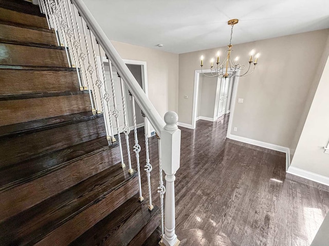 2914 Ridge Rd, Lansing, IL 60438 - staircase featuring a chandelier and wood finished floors
