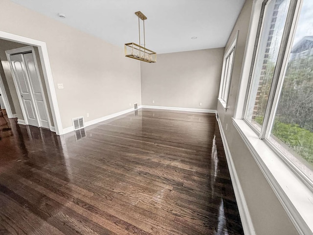 2914 Ridge Rd, Lansing, IL 60438 - unfurnished dining area featuring dark wood-type flooring and a chandelier