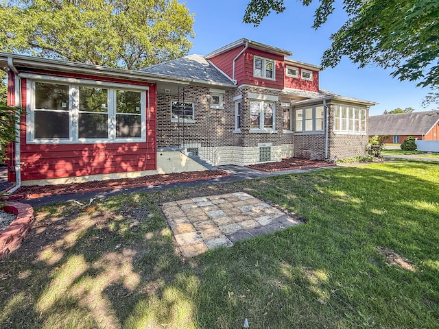 2914 Ridge Rd, Lansing, IL 60438 - back of house with a yard and brick siding