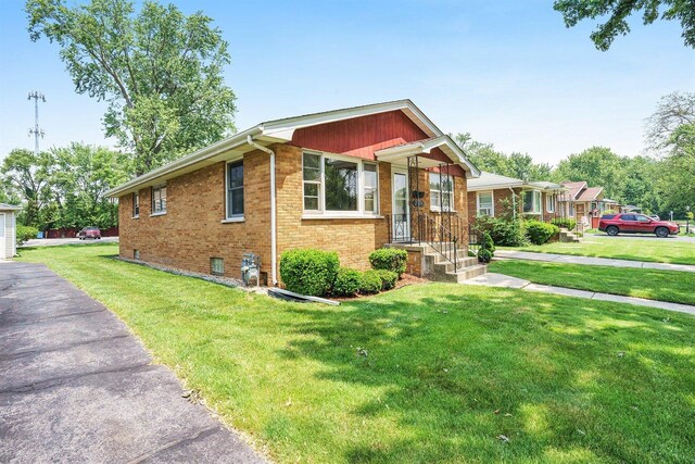 2454 184th St, Lansing, IL 60438 - view of front facade featuring brick siding and a front lawn