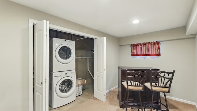 5321 Meadowbrook St, Plainfield, IL 60586 - laundry room featuring stacked washing machine and dryer and carpet flooring