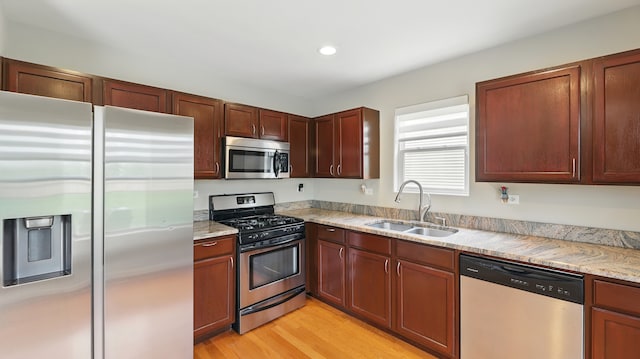 5321 Meadowbrook St, Plainfield, IL 60586 - kitchen with appliances with stainless steel finishes, light wood finished floors, recessed lighting, and light stone counters