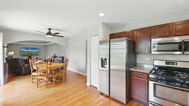 5321 Meadowbrook St, Plainfield, IL 60586 - kitchen with appliances with stainless steel finishes, arched walkways, a ceiling fan, light wood-style floors, and recessed lighting