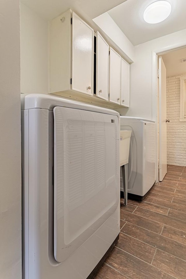 1328 Concord Ln, Schaumburg, IL 60193 - laundry area with cabinet space, dark wood-type flooring, and washer / dryer