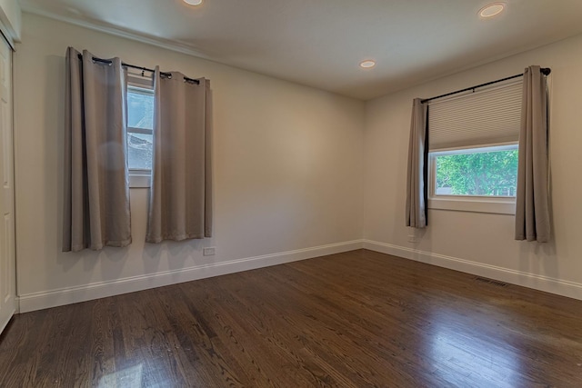 1328 Concord Ln, Schaumburg, IL 60193 - empty room featuring dark wood-style flooring and recessed lighting