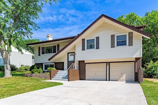 1328 Concord Ln, Schaumburg, IL 60193 - bi-level home with an attached garage, brick siding, driveway, a front yard, and a chimney