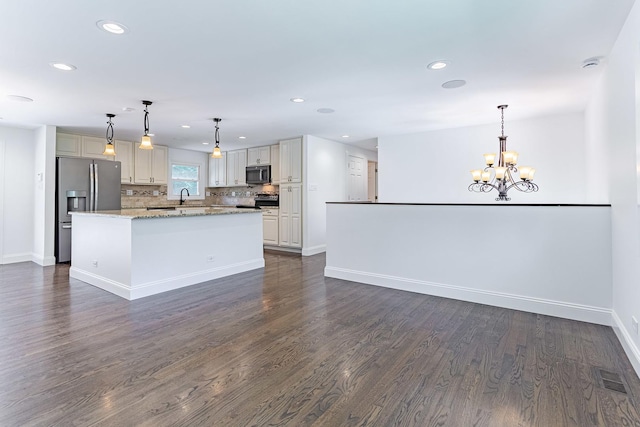 1328 Concord Ln, Schaumburg, IL 60193 - kitchen with appliances with stainless steel finishes, recessed lighting, dark wood-type flooring, a chandelier, and tasteful backsplash