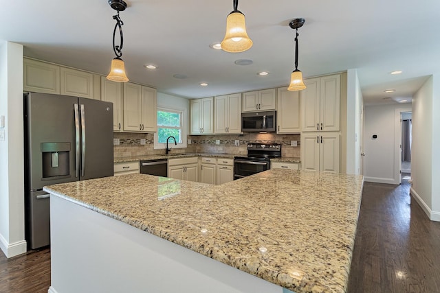 1328 Concord Ln, Schaumburg, IL 60193 - kitchen with appliances with stainless steel finishes, dark wood-style floors, light stone counters, tasteful backsplash, and decorative light fixtures
