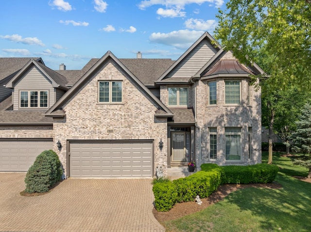 1835 Rizzi Ln, Bartlett, IL 60103 - view of front of house featuring brick siding, decorative driveway, a garage, and a shingled roof