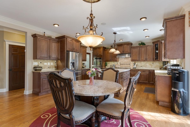 1835 Rizzi Ln, Bartlett, IL 60103 - dining space featuring light wood finished floors, recessed lighting, and ornamental molding
