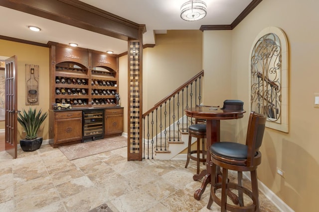 1835 Rizzi Ln, Bartlett, IL 60103 - wine area with beverage cooler, crown molding, light stone finish floors, and built in shelves