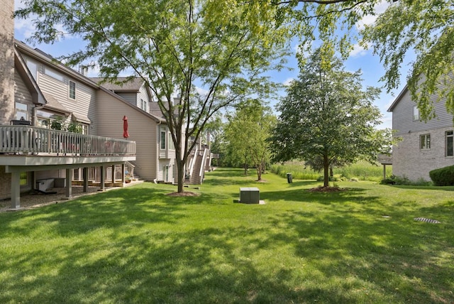 1835 Rizzi Ln, Bartlett, IL 60103 - view of green lawn featuring stairway and a deck