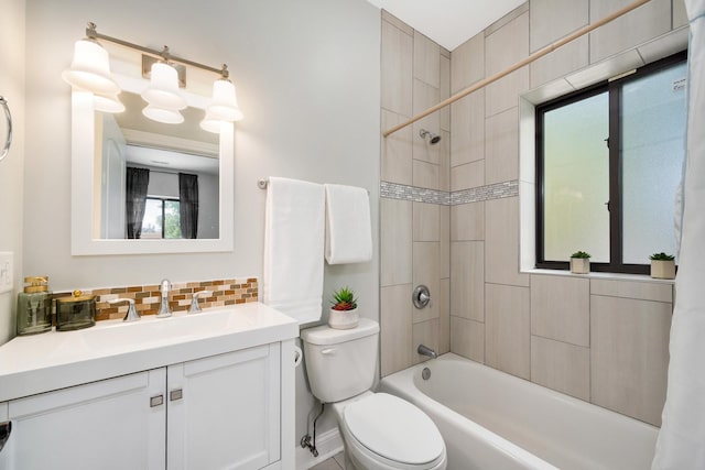 3437 S Morgan St Unit 2E, Chicago, IL 60608 - full bathroom featuring toilet, decorative backsplash, vanity, and shower / bathtub combination