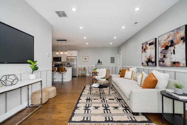 3437 S Morgan St Unit 2E, Chicago, IL 60608 - living room featuring a wainscoted wall, dark wood-type flooring, recessed lighting, and a decorative wall