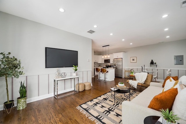 3437 S Morgan St Unit 2E, Chicago, IL 60608 - living room featuring electric panel, dark wood finished floors, recessed lighting, and a wainscoted wall