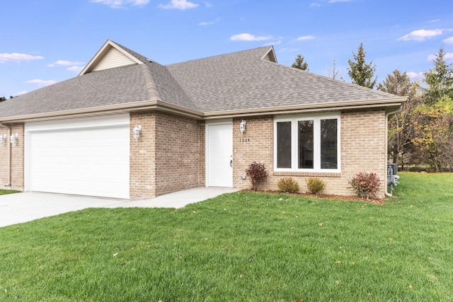 5540 Hearthside Dr, Bourbonnais, IL 60914 - ranch-style home with a shingled roof, a garage, a front lawn, and concrete driveway