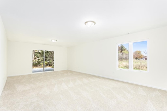 5540 Hearthside Dr, Bourbonnais, IL 60914 - spare room with light carpet and baseboards