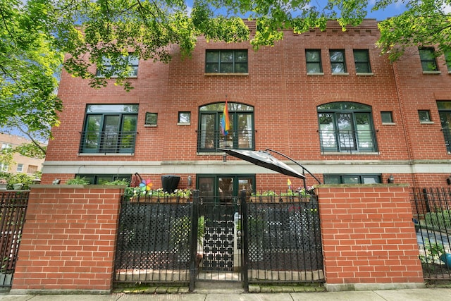 5844 N Hermitage Ave Unit B, Chicago, IL 60660 - view of front of home featuring brick siding and a fenced front yard