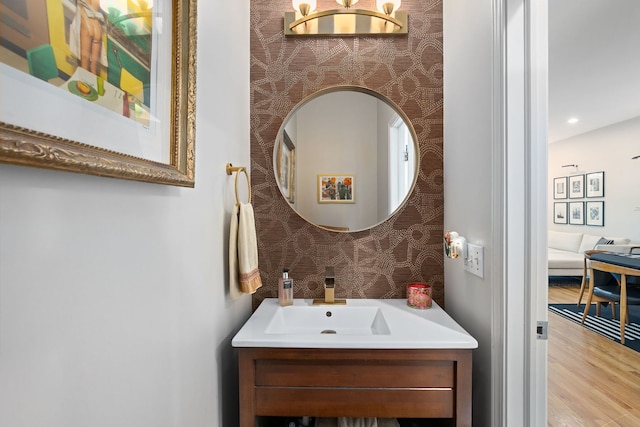 5844 N Hermitage Ave Unit B, Chicago, IL 60660 - bathroom featuring vanity, wood finished floors, and wallpapered walls