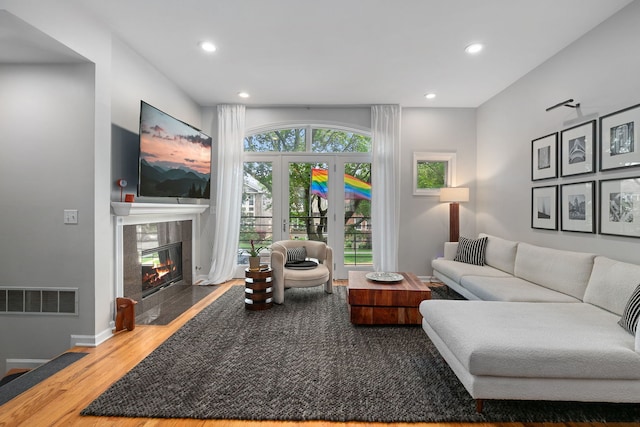 5844 N Hermitage Ave Unit B, Chicago, IL 60660 - living room featuring wood finished floors, a fireplace, and recessed lighting