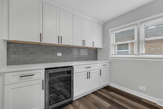 6037 S Mason Ave, Chicago, IL 60638 - bar with wine cooler, decorative backsplash, baseboards, and dark wood finished floors