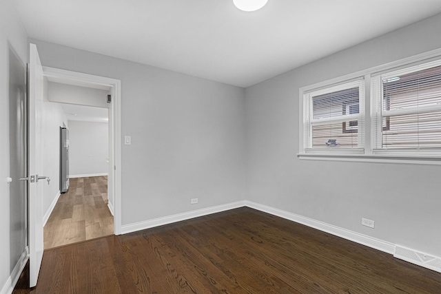 6037 S Mason Ave, Chicago, IL 60638 - empty room with baseboards and dark wood-style floors