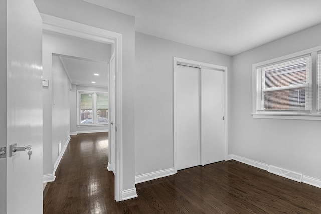 6037 S Mason Ave, Chicago, IL 60638 - unfurnished bedroom featuring wood finished floors, baseboards, and a closet