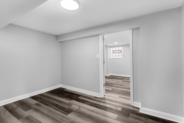 6037 S Mason Ave, Chicago, IL 60638 - below grade area featuring dark wood-style flooring and baseboards
