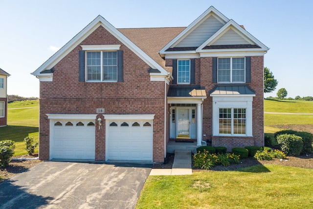 15 Open Pkwy N, Hawthorn Woods, IL 60047 - view of front facade with brick siding, a front yard, an attached garage, driveway, and a shingled roof