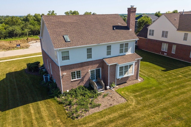 15 Open Pkwy N, Hawthorn Woods, IL 60047 - back of house featuring a chimney, brick siding, and a lawn