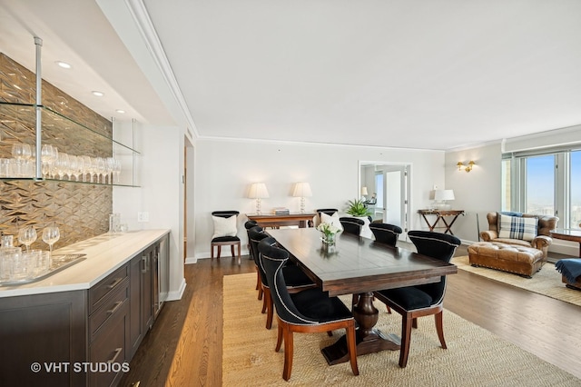 132 E Delaware Pl Unit 5106, Chicago, IL 60611 - dining room with bar, crown molding, and wood finished floors
