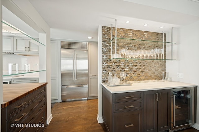 132 E Delaware Pl Unit 5106, Chicago, IL 60611 - indoor wet bar featuring built in refrigerator, wine cooler, dark wood finished floors, and recessed lighting