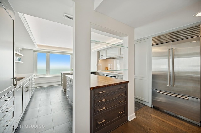 132 E Delaware Pl Unit 5106, Chicago, IL 60611 - kitchen with stainless steel built in refrigerator, wood counters, and a water view