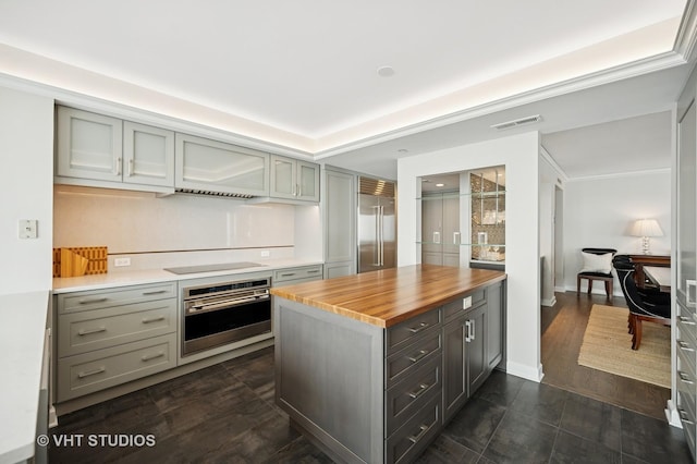 132 E Delaware Pl Unit 5106, Chicago, IL 60611 - kitchen with stainless steel appliances, butcher block counters, gray cabinetry, and a kitchen island