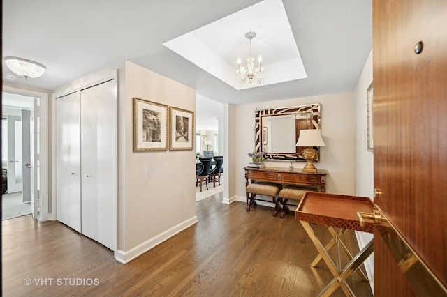 132 E Delaware Pl Unit 5106, Chicago, IL 60611 - hallway featuring wood finished floors, a chandelier, and a tray ceiling