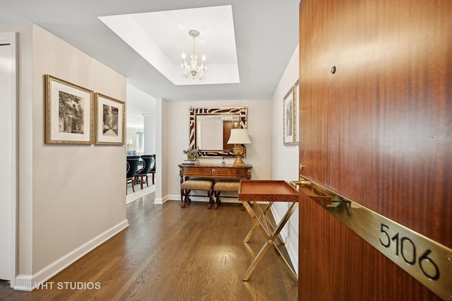 132 E Delaware Pl Unit 5106, Chicago, IL 60611 - corridor featuring dark wood-style floors, a chandelier, and a tray ceiling