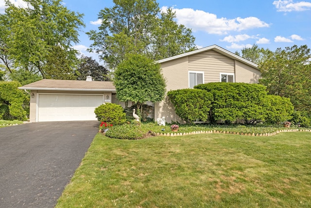 5927 Sherman Dr, Woodridge, IL 60517 - view of front facade with a front lawn, asphalt driveway, brick siding, a chimney, and a garage