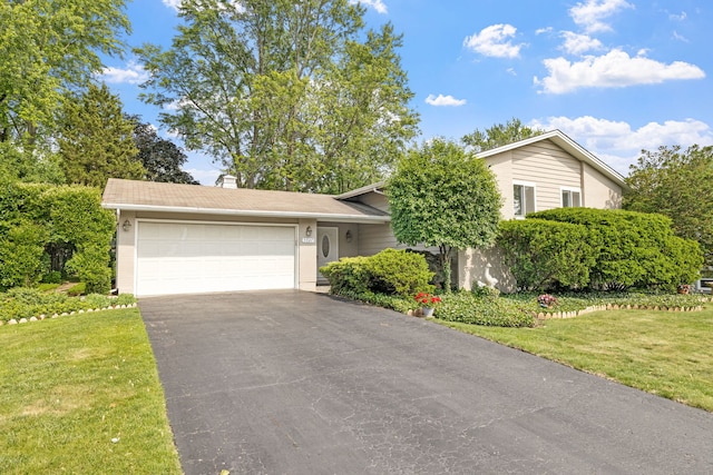5927 Sherman Dr, Woodridge, IL 60517 - view of front of house with asphalt driveway, a garage, a front lawn, and a chimney