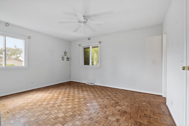 5927 Sherman Dr, Woodridge, IL 60517 - spare room with baseboards and a ceiling fan
