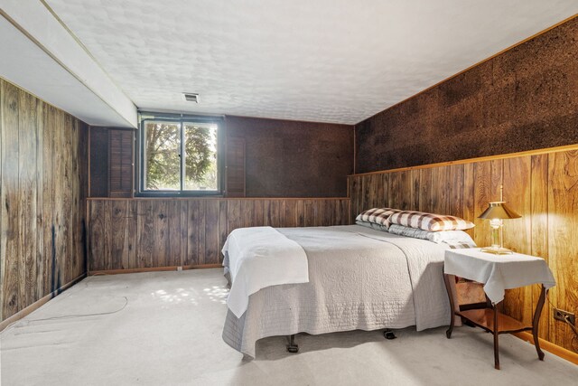 5927 Sherman Dr, Woodridge, IL 60517 - bedroom featuring wood walls, a textured ceiling, and carpet flooring