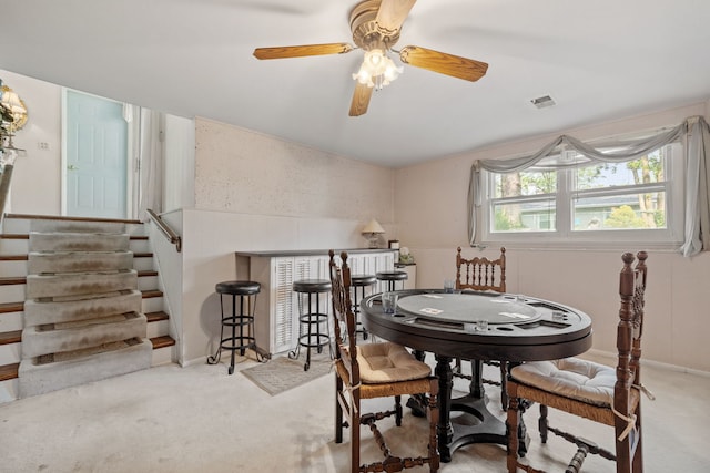 5927 Sherman Dr, Woodridge, IL 60517 - carpeted dining space featuring stairs, a ceiling fan, a bar, and baseboards
